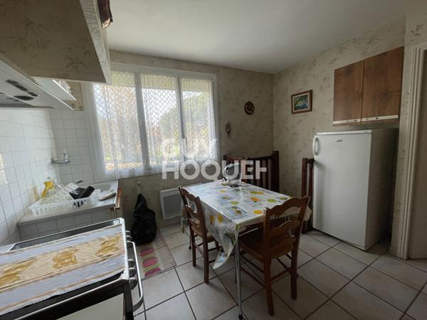 Maison familiale avec grand terrain et garage