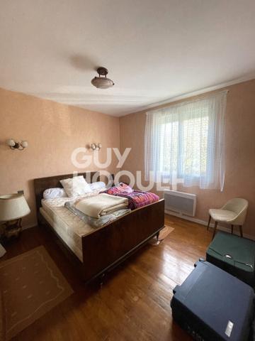 Maison familiale avec grand terrain et garage