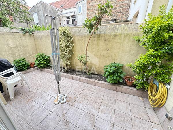 À vendre appartement de charme en rez-de-chaussée avec terrasse