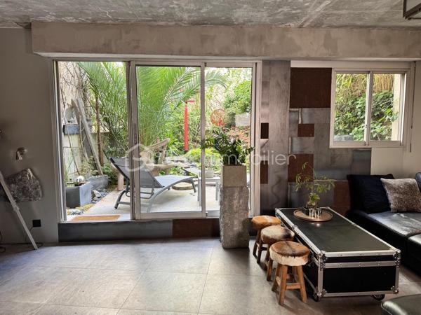 75 m2 pour cet incroyable univers à vivre, il revendique une esthétique résolument brutaliste. Situé au 1er étage avec ascenseur, il est distribué comme suit, un appartement de 54 m² Carrez avec 2 chambres, balcon de 2 m²(pondéré à 1m2) et son jardin japonais de 60 m² (pondéré à 20m2).
Le vaste séjour de 25 m² s’ouvre sur un magnifique jardin japonais privatif orienté à l’est, offrant un cadre de vie rare et apaisant.
L’appartement comprend une suite avec baignoire, une seconde chambre bénéficiant de son propre balcon, un dressing ainsi qu’une salle d’eau avec WC.Chaque matériau a été soigneusement sélectionné pour composer un univers architectural unique. Le béton vibré des murs dialogue avec le quartzite oxydé du plan de travail, le schiste noir des salles d’eau et les finitions en aluminium anodisé.

Une grande place de parking en sous-sol complète ce bien.

Véritable œuvre de design habitable, cet appartement a été entièrement pensé et aménagé par son propriétaire actuel. L’ensemble du mobilier, des équipements et des éléments décoratifs est inclus dans la vente : vous n’aurez qu’à poser vos valises.

Le parc des Buttes-Chaumont et le Rosa Bonheur sont accessibles à pied. Vous profiterez également de la proximité immédiate d’un marché, de nombreux commerces et de toutes les commodités du quartier.


Located on the first floor of a building with elevator access, this remarkable living space offers 75 sqm of weighted area, boldly combining a brutalist and contemporary aesthetic with the serenity of a 60 sqm Japanese garden (weighted at 20 sqm). The property comprises a 54 sqm Carrez-law apartment extended by a 2 sqm balcony (weighted at 1 sqm), creating a distinctive and inspiring living environment. Every material has been carefully selected to create a unique architectural environment. The vibrated concrete walls interact harmoniously with the oxidized quartzite countertop, the black slate used in the bathrooms, and the anodized aluminum finishes.

The spacious 25 sqm living room opens onto a magnificent private Japanese garden facing east, offering a rare and peaceful living environment. The apartment includes a primary suite with a bathtub, a second bedroom with its own private balcony, a walk-in dressing room, and a shower room with a toilet.

A large underground parking space completes the property.

A true piece of livable design, this apartment was entirely conceived and fitted out by its current owner. All furniture, equipment, and decorative elements are included in the sale—you only need to bring your suitcases.

The Buttes-Chaumont Park and Rosa Bonheur are within walking distance, and you will also benefit from the immediate proximity of a local market, numerous shops, and all the amenities the neighborhood has to offer.