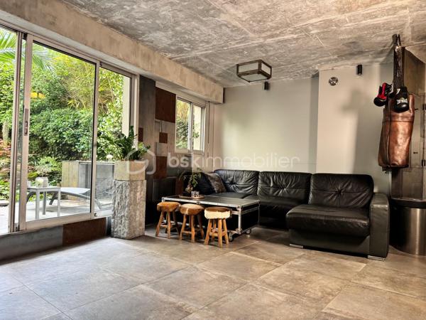 75 m2 pour cet incroyable univers à vivre, il revendique une esthétique résolument brutaliste. Situé au 1er étage avec ascenseur, il est distribué comme suit, un appartement de 54 m² Carrez avec 2 chambres, balcon de 2 m²(pondéré à 1m2) et son jardin japonais de 60 m² (pondéré à 20m2).
Le vaste séjour de 25 m² s’ouvre sur un magnifique jardin japonais privatif orienté à l’est, offrant un cadre de vie rare et apaisant.
L’appartement comprend une suite avec baignoire, une seconde chambre bénéficiant de son propre balcon, un dressing ainsi qu’une salle d’eau avec WC.Chaque matériau a été soigneusement sélectionné pour composer un univers architectural unique. Le béton vibré des murs dialogue avec le quartzite oxydé du plan de travail, le schiste noir des salles d’eau et les finitions en aluminium anodisé.

Une grande place de parking en sous-sol complète ce bien.

Véritable œuvre de design habitable, cet appartement a été entièrement pensé et aménagé par son propriétaire actuel. L’ensemble du mobilier, des équipements et des éléments décoratifs est inclus dans la vente : vous n’aurez qu’à poser vos valises.

Le parc des Buttes-Chaumont et le Rosa Bonheur sont accessibles à pied. Vous profiterez également de la proximité immédiate d’un marché, de nombreux commerces et de toutes les commodités du quartier.


Located on the first floor of a building with elevator access, this remarkable living space offers 75 sqm of weighted area, boldly combining a brutalist and contemporary aesthetic with the serenity of a 60 sqm Japanese garden (weighted at 20 sqm). The property comprises a 54 sqm Carrez-law apartment extended by a 2 sqm balcony (weighted at 1 sqm), creating a distinctive and inspiring living environment. Every material has been carefully selected to create a unique architectural environment. The vibrated concrete walls interact harmoniously with the oxidized quartzite countertop, the black slate used in the bathrooms, and the anodized aluminum finishes.

The spacious 25 sqm living room opens onto a magnificent private Japanese garden facing east, offering a rare and peaceful living environment. The apartment includes a primary suite with a bathtub, a second bedroom with its own private balcony, a walk-in dressing room, and a shower room with a toilet.

A large underground parking space completes the property.

A true piece of livable design, this apartment was entirely conceived and fitted out by its current owner. All furniture, equipment, and decorative elements are included in the sale—you only need to bring your suitcases.

The Buttes-Chaumont Park and Rosa Bonheur are within walking distance, and you will also benefit from the immediate proximity of a local market, numerous shops, and all the amenities the neighborhood has to offer.