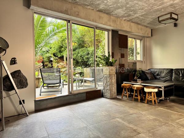 75 m2 pour cet incroyable univers à vivre, il revendique une esthétique résolument brutaliste. Situé au 1er étage avec ascenseur, il est distribué comme suit, un appartement de 54 m² Carrez avec 2 chambres, balcon de 2 m²(pondéré à 1m2) et son jardin japonais de 60 m² (pondéré à 20m2).
Le vaste séjour de 25 m² s’ouvre sur un magnifique jardin japonais privatif orienté à l’est, offrant un cadre de vie rare et apaisant.
L’appartement comprend une suite avec baignoire, une seconde chambre bénéficiant de son propre balcon, un dressing ainsi qu’une salle d’eau avec WC.Chaque matériau a été soigneusement sélectionné pour composer un univers architectural unique. Le béton vibré des murs dialogue avec le quartzite oxydé du plan de travail, le schiste noir des salles d’eau et les finitions en aluminium anodisé.

Une grande place de parking en sous-sol complète ce bien.

Véritable œuvre de design habitable, cet appartement a été entièrement pensé et aménagé par son propriétaire actuel. L’ensemble du mobilier, des équipements et des éléments décoratifs est inclus dans la vente : vous n’aurez qu’à poser vos valises.

Le parc des Buttes-Chaumont et le Rosa Bonheur sont accessibles à pied. Vous profiterez également de la proximité immédiate d’un marché, de nombreux commerces et de toutes les commodités du quartier.


Located on the first floor of a building with elevator access, this remarkable living space offers 75 sqm of weighted area, boldly combining a brutalist and contemporary aesthetic with the serenity of a 60 sqm Japanese garden (weighted at 20 sqm). The property comprises a 54 sqm Carrez-law apartment extended by a 2 sqm balcony (weighted at 1 sqm), creating a distinctive and inspiring living environment. Every material has been carefully selected to create a unique architectural environment. The vibrated concrete walls interact harmoniously with the oxidized quartzite countertop, the black slate used in the bathrooms, and the anodized aluminum finishes.

The spacious 25 sqm living room opens onto a magnificent private Japanese garden facing east, offering a rare and peaceful living environment. The apartment includes a primary suite with a bathtub, a second bedroom with its own private balcony, a walk-in dressing room, and a shower room with a toilet.

A large underground parking space completes the property.

A true piece of livable design, this apartment was entirely conceived and fitted out by its current owner. All furniture, equipment, and decorative elements are included in the sale—you only need to bring your suitcases.

The Buttes-Chaumont Park and Rosa Bonheur are within walking distance, and you will also benefit from the immediate proximity of a local market, numerous shops, and all the amenities the neighborhood has to offer.