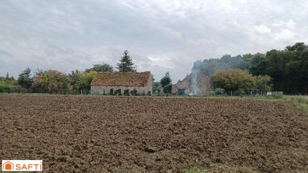 Grange en pierre à rénover sur terrain arboré de plus de 1000m2 à 5 minutes de Beaune La Rolande