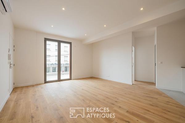 Appartement au dernier étage baigné de lumière à deux pas du Marché Central