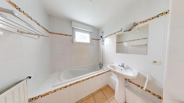 Appartement 3 pièces Rixheim – Rez-de-jardin calme avec terrasse, cave et garage fermé