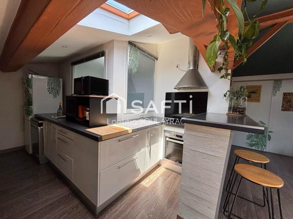 Bel appartement en centre ville, avec cave et jardin.