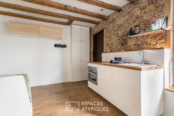 Studio rénové avec pierres apparentes au coeur de Saint-Paul