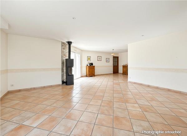 Maison de plain-pied avec jardin paysagé de 1 000 m² et terrasse exposée sud
