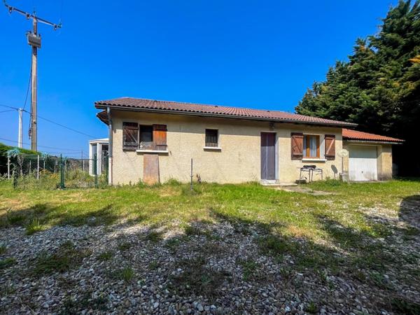 Maison de plain-pied avec garage et véranda