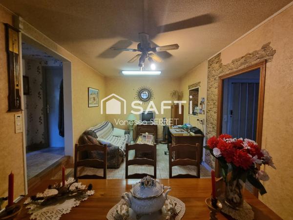 Immeuble avec commerce et logements – plein centre du Molay-Littry