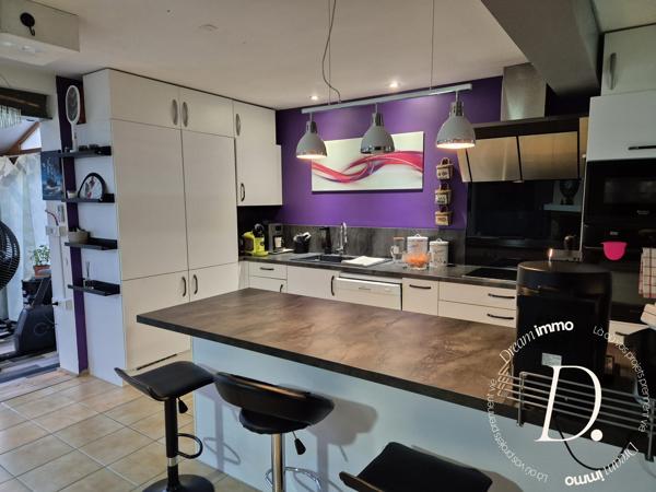 SEJOUR AVEC VERANDA ET CUISINE AMERICAINE 50 M²