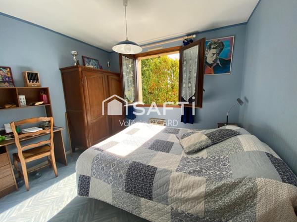 Maison T6 avec garage sur terrain arboré de 2000m2