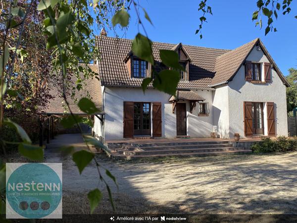 Une maison familiale aux beaux volumes, avec jardin, garage et sous-sol total à Olivet