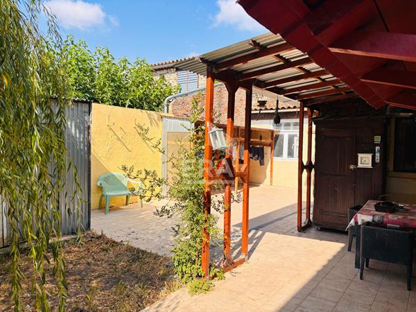 Maison en pierre de 129 m² avec grange, garage et jardin