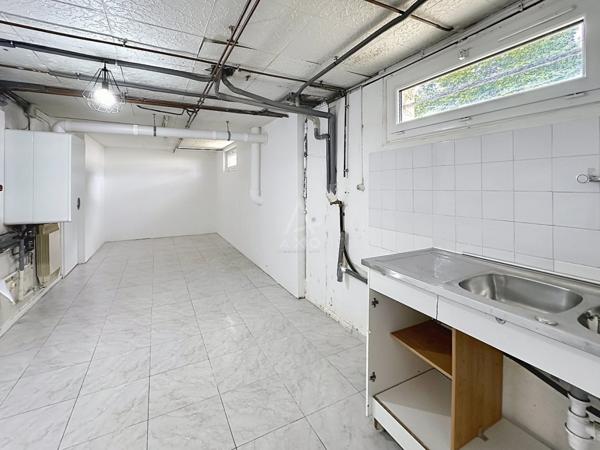 Maison traditionnelle sur deux niveaux d'environ 101 m²