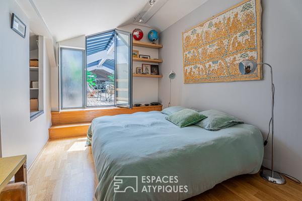 Loft avec patio dans un ancien garage automobile