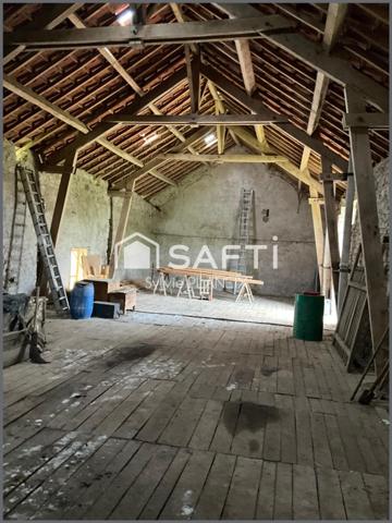 Magnifique ensemble immobilier avec grange, cave, étable, atelier, terrain agricole à Flayat !