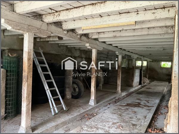 Magnifique ensemble immobilier avec grange, cave, étable, atelier, terrain agricole à Flayat !