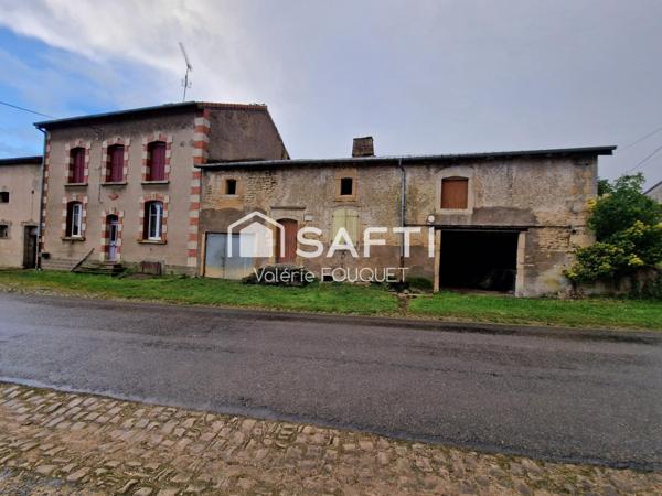 Situé à Vaudoncourt bel ensemble immobilier de caractère avec dépendances sur grand terrain