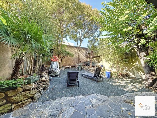 Maison T7 de 160m² avec jardin, caves et garages