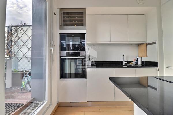 Rare sur le marché : duplex récent avec 70 m² d'extérieurs et vue La Défense / Tour Eiffel