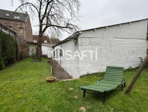Belle demeure à Doullens, 5 chambres, garage pour plusieurs véhicules, dépendances, jardin.