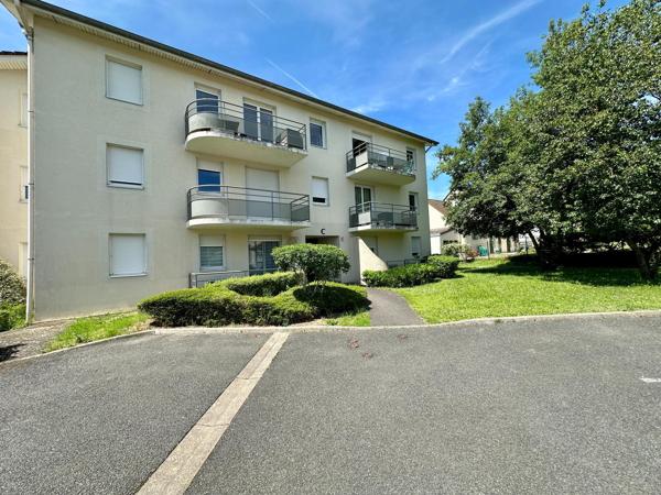 Appartement avec 2 chambres, balcon et place de parking