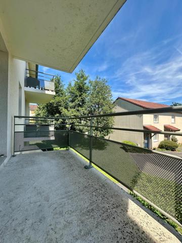 Appartement avec 2 chambres, balcon et place de parking