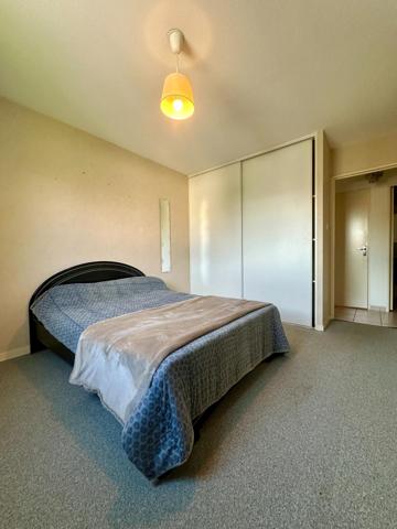 Appartement avec 2 chambres, balcon et place de parking