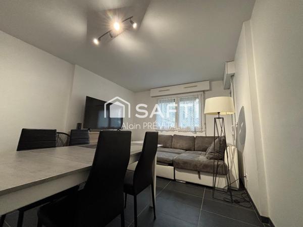Appartement comprenant une terrasse, un garage et une cave