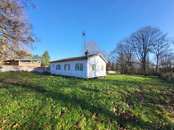 Terrain à bâtir avec châlet en bois