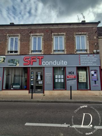 Commerce, habitation, grange et terrain constructible potentiel en centre-ville