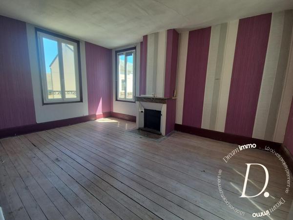 Commerce, habitation, grange et terrain constructible potentiel en centre-ville