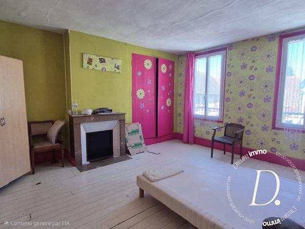 Commerce, habitation, grange et terrain constructible potentiel en centre-ville
