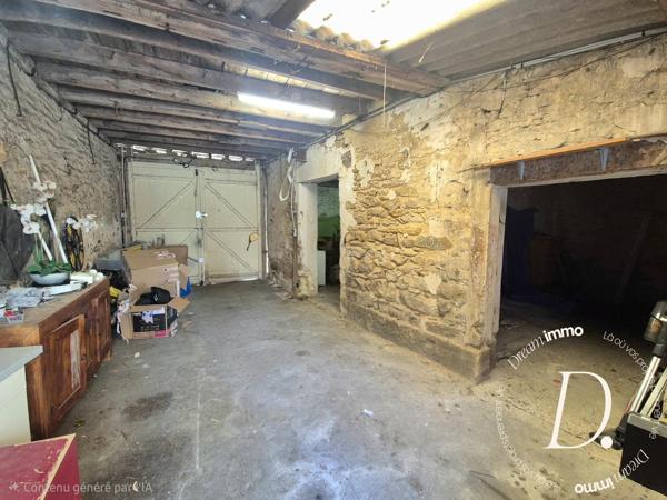 Commerce, habitation, grange et terrain constructible potentiel en centre-ville