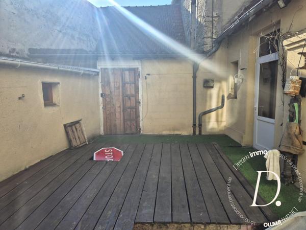 Commerce, habitation, grange et terrain constructible potentiel en centre-ville