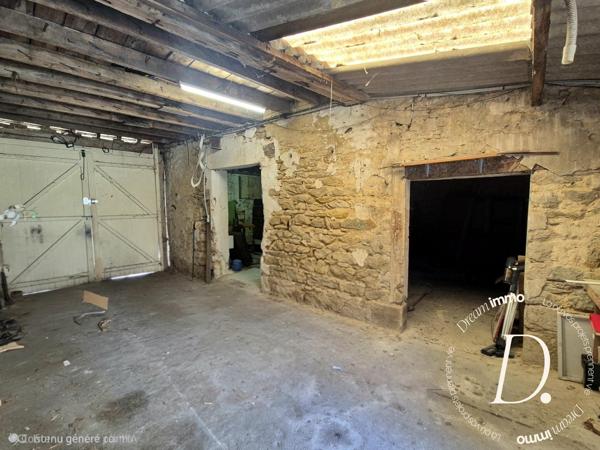Commerce, habitation, grange et terrain constructible potentiel en centre-ville