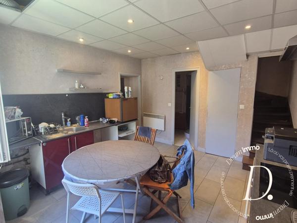 Commerce, habitation, grange et terrain constructible potentiel en centre-ville
