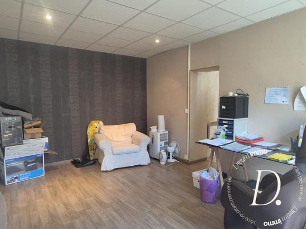 Commerce, habitation, grange et terrain constructible potentiel en centre-ville