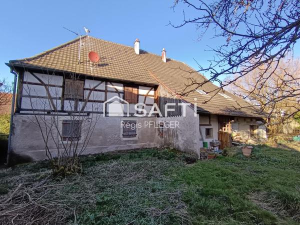 Maison de caractère avec beau potentiel