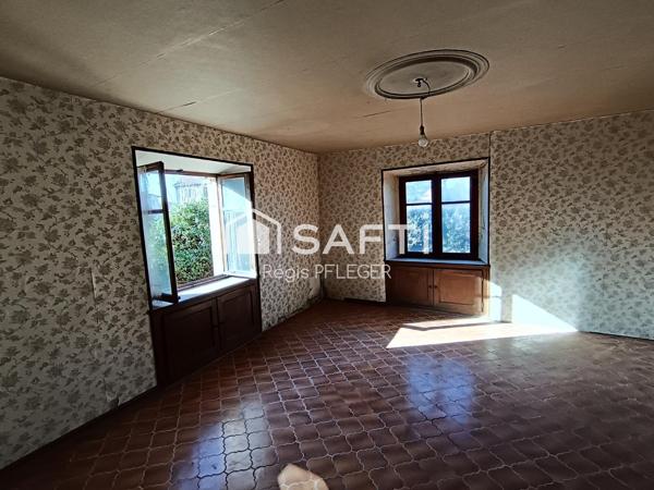 Maison de caractère avec beau potentiel