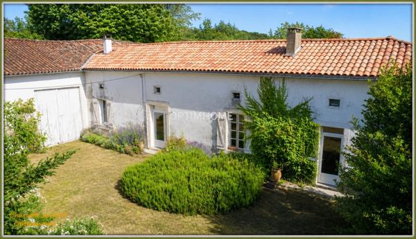 ensemble de 2 maisons en pierre + grange + grand terrain