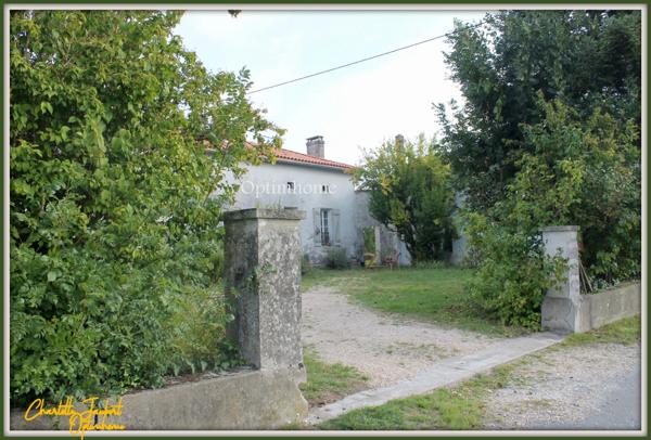 ensemble de 2 maisons en pierre + grange + grand terrain