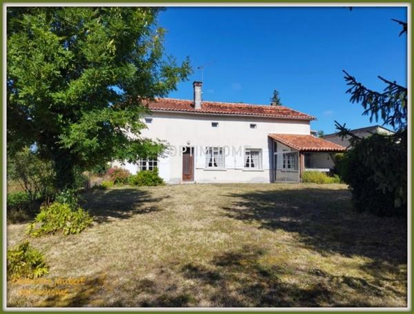 ensemble de 2 maisons en pierre + grange + grand terrain