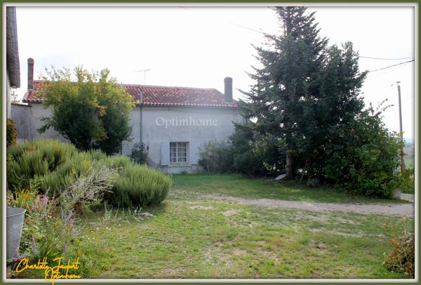 ensemble de 2 maisons en pierre + grange + grand terrain