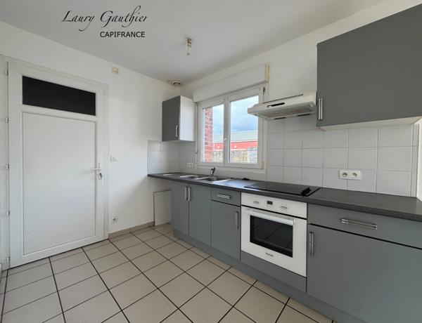 Maison semi-individuelle 66 m² – 2 chambres – Garage – Jardin – Calme – Centre de Comines