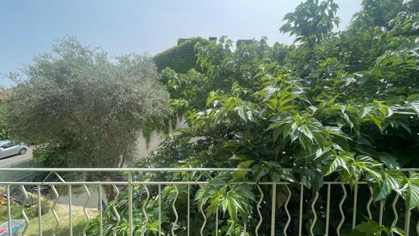 Maison de ville avec garage et jardin