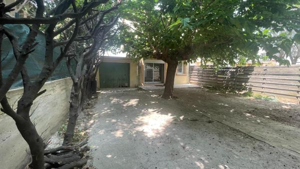 Maison de ville avec garage et jardin