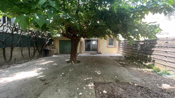 Maison de ville avec garage et jardin