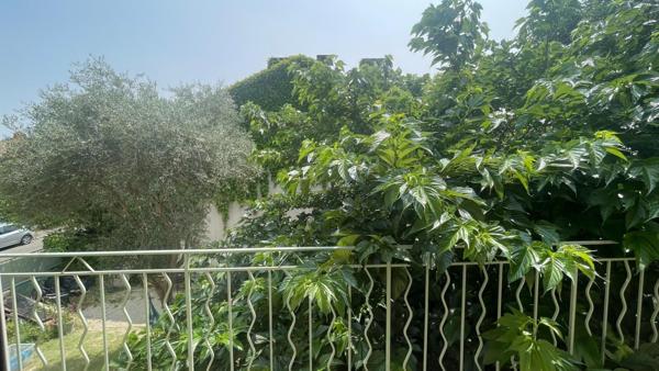 Maison de ville avec garage et jardin